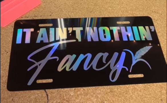 IT AIN'T NOTHIN' FANCY LICENSE PLATE image 0